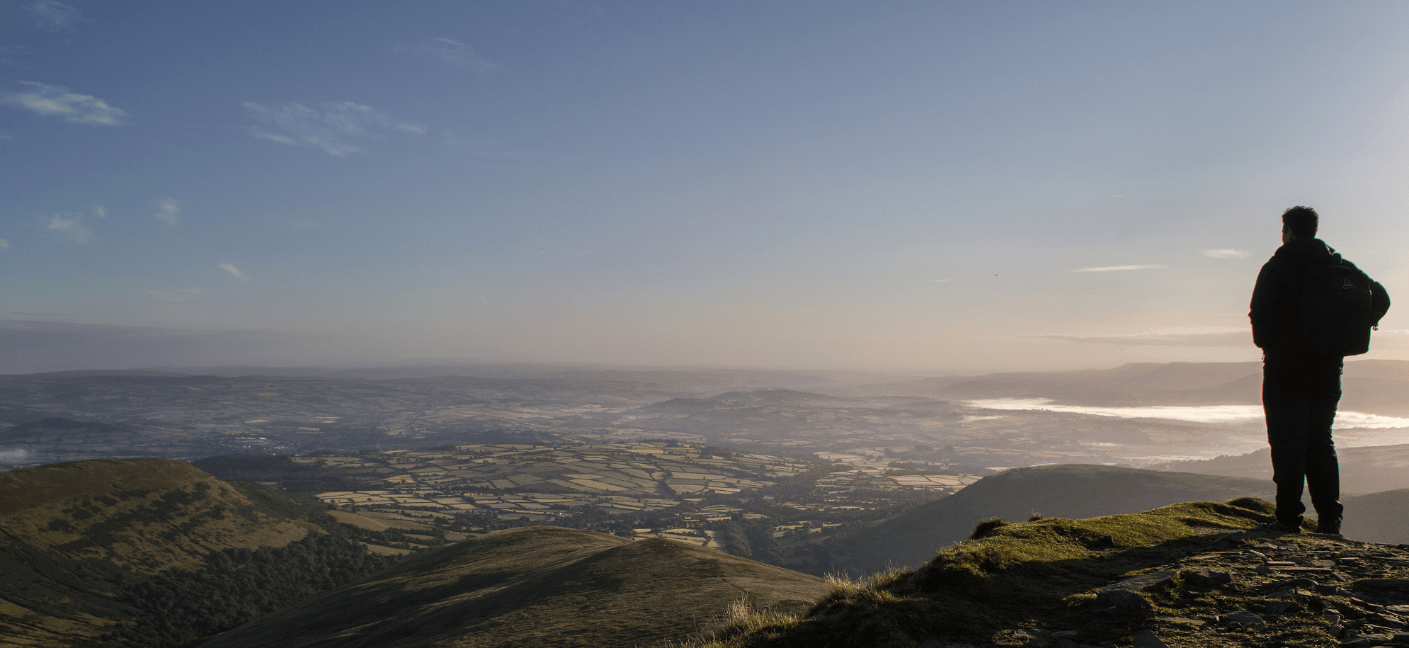 Walker staring out over Brecon Beacons