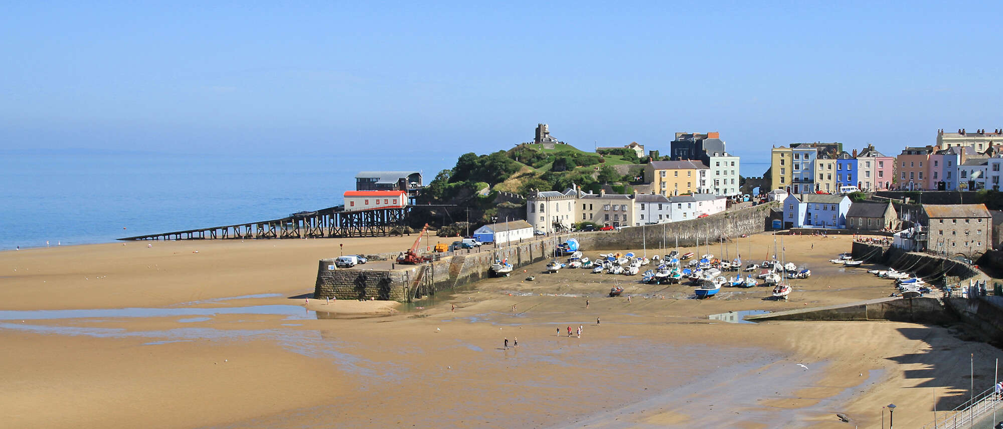 Spring sunshine on Tenby North Beach and harbour, Pembrokeshire, Wales