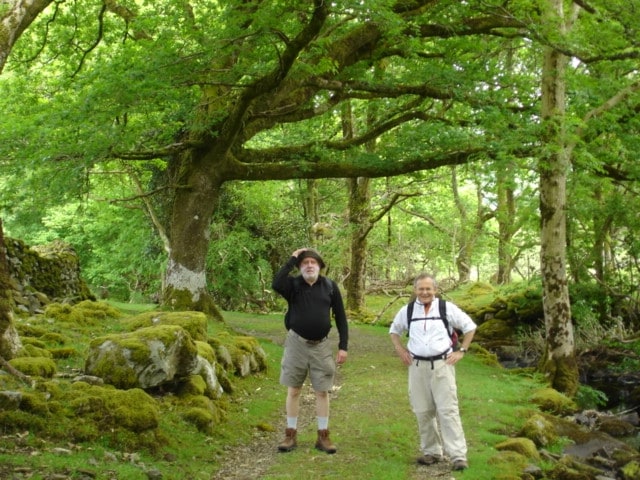 Larry and Benet walking through forest