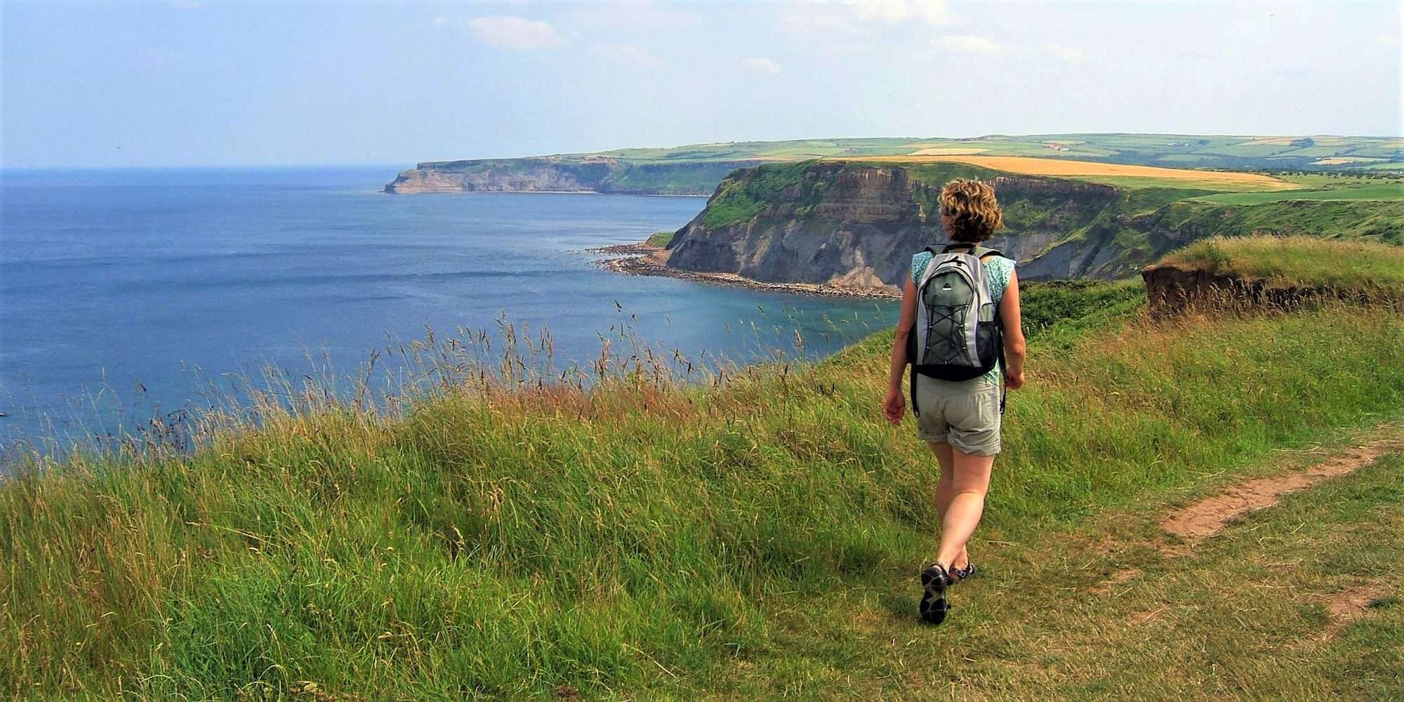 Hiker admiring the views out over the cliffs