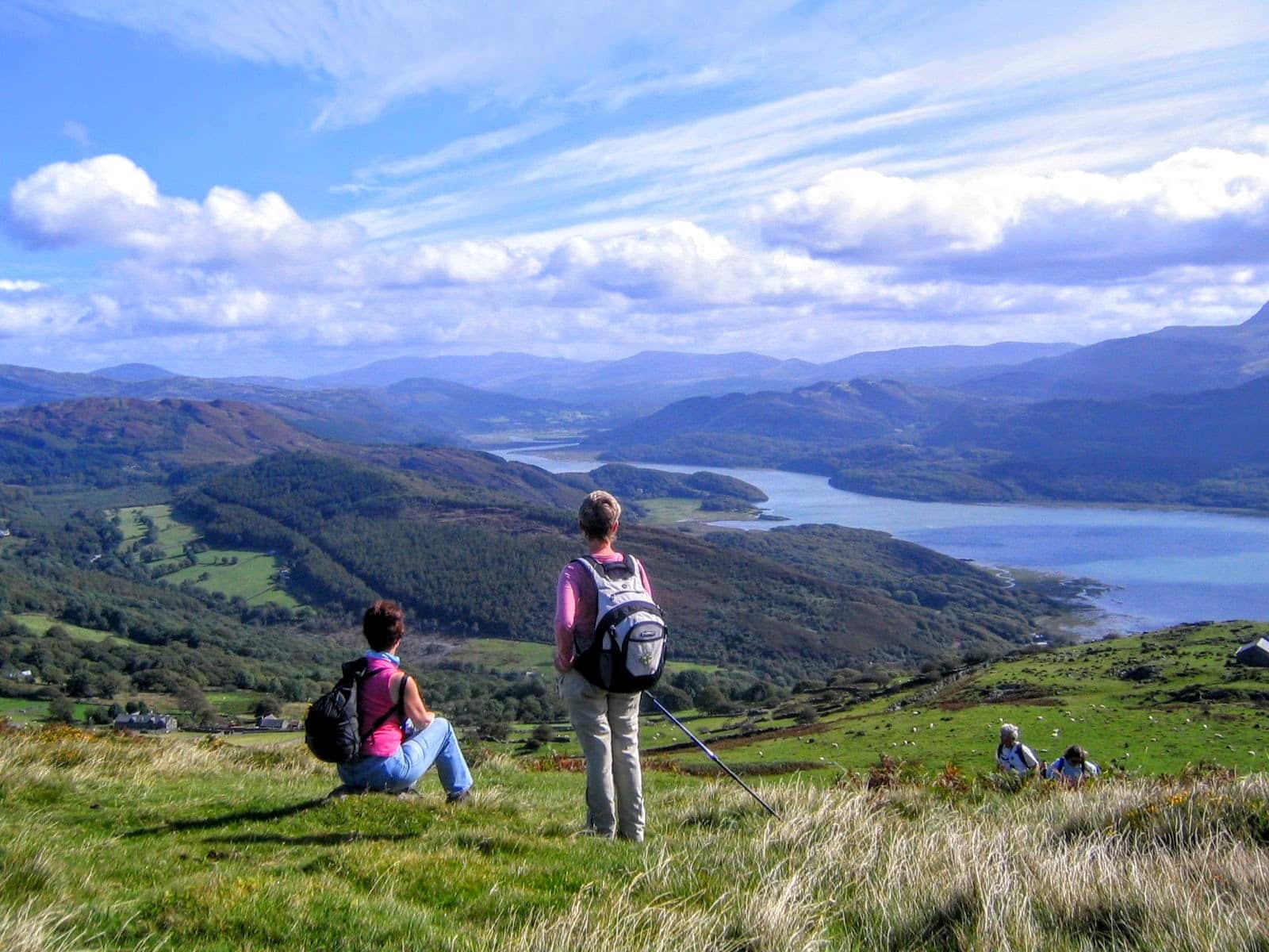 Two women gazing over the Mawddach estuary