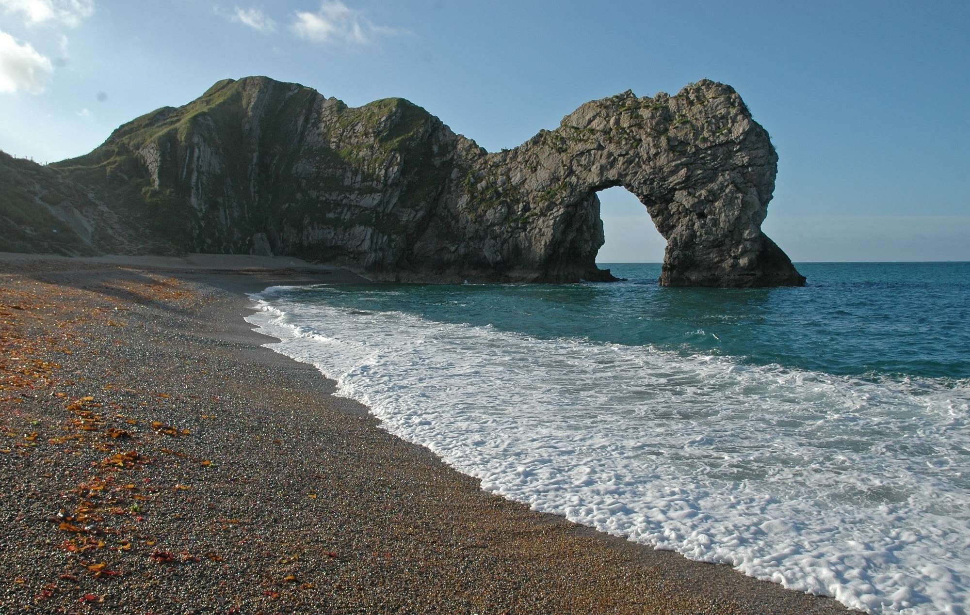 Landscape of Durdle Door on bright sunny day, near Lulworth, Dorset, South England