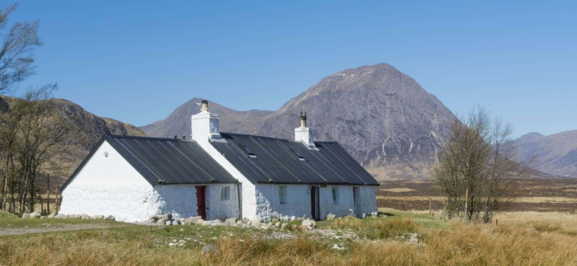 Blackrock Cottage, situated on the access road to the Glencoe mountain ski area with Buachaille Etive Mor seen beyond