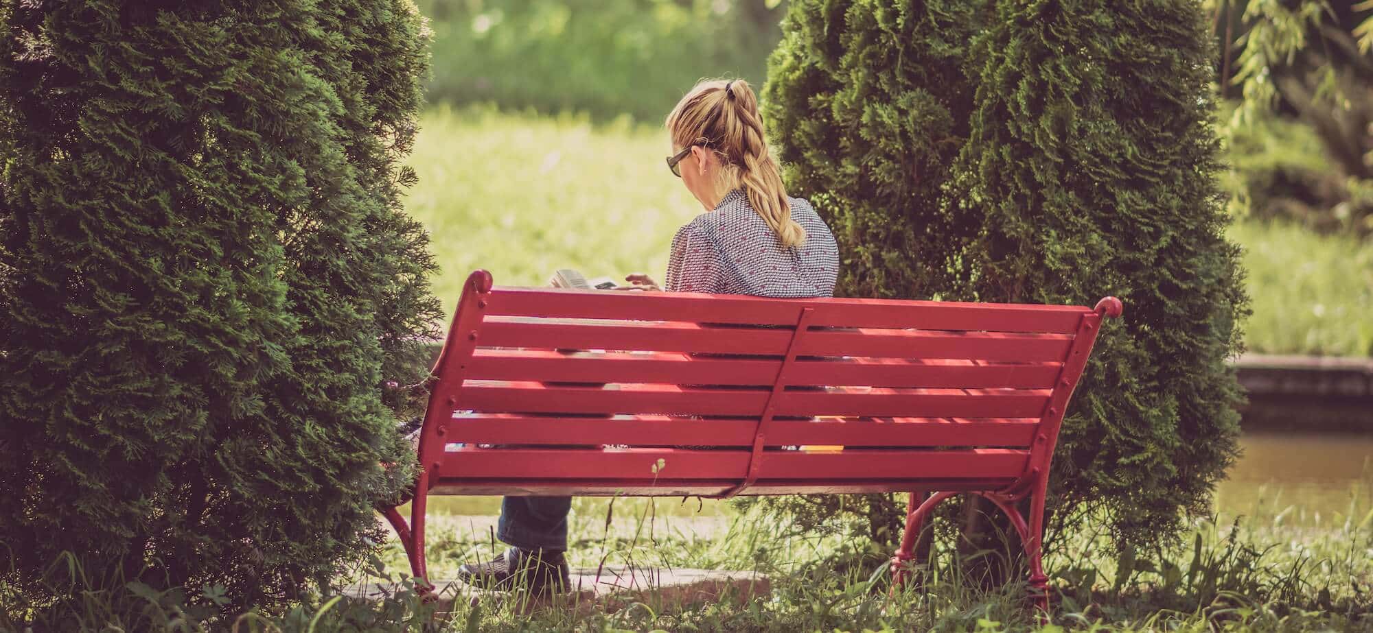 Woman-Reading-on-a-Bench