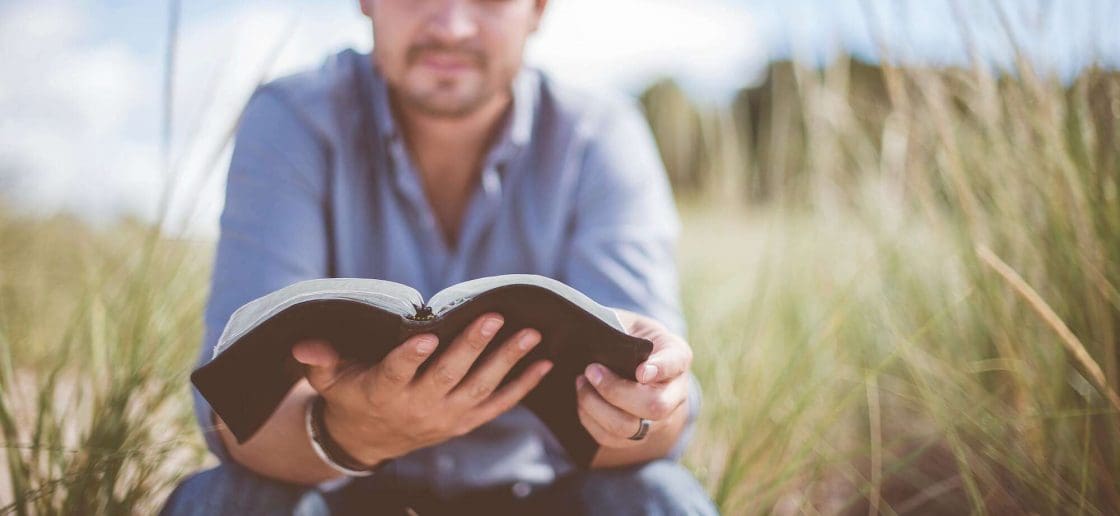 Man reading in Field