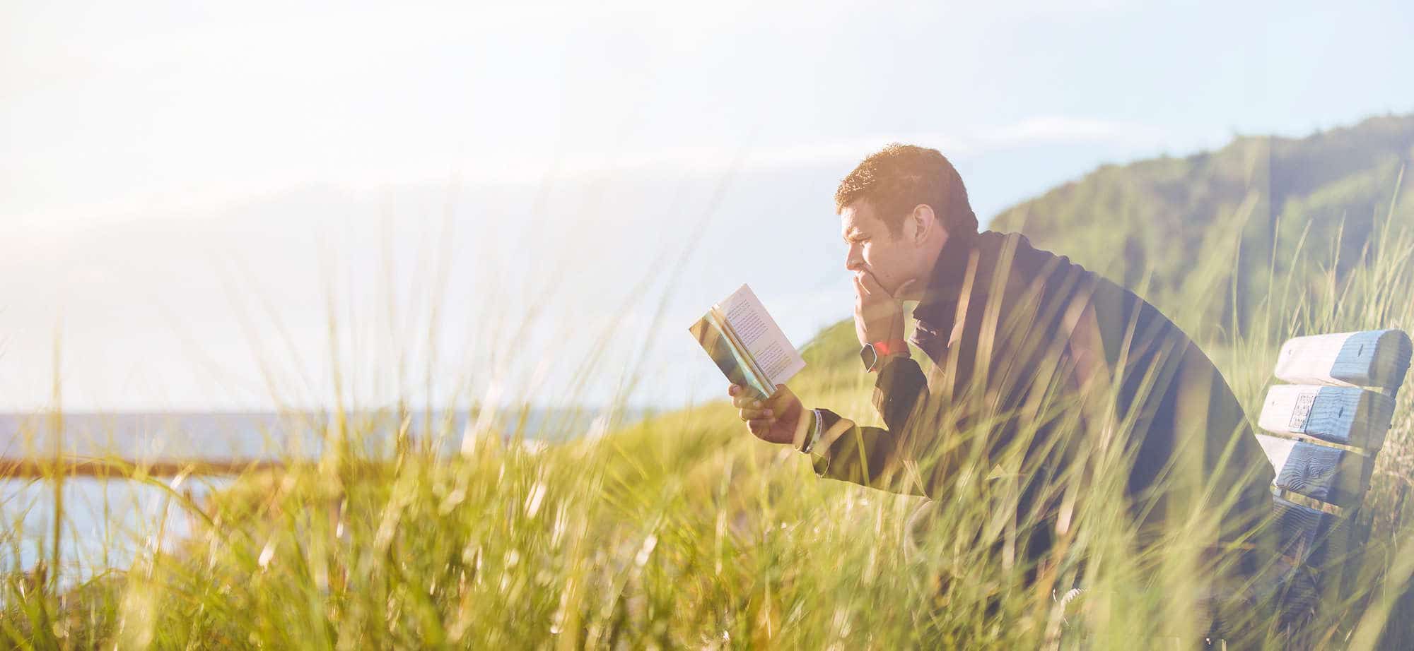 Man reading while hiking