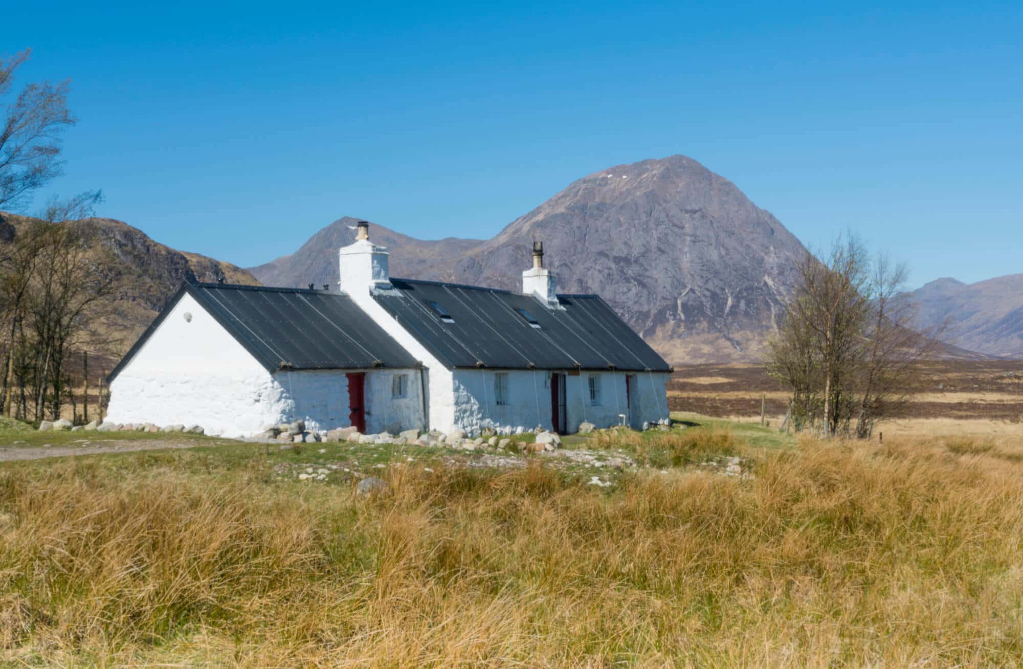 Blackrock Cottage, situated on the access road to the Glencoe mountain ski area with Buachaille Etive Mor seen beyond