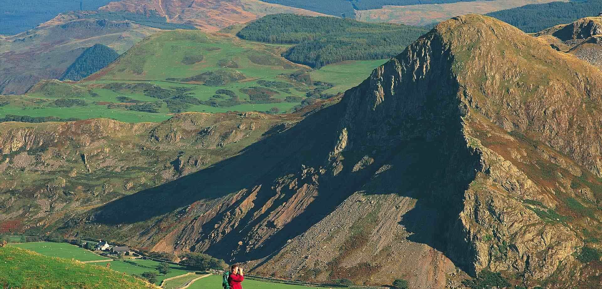 Man at mountains with binoculars