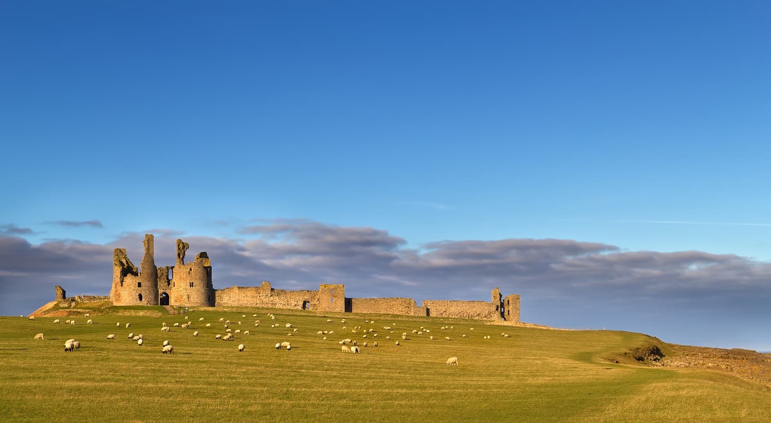 Dunstanburgh Castle Featured 100 walks Britain Blog