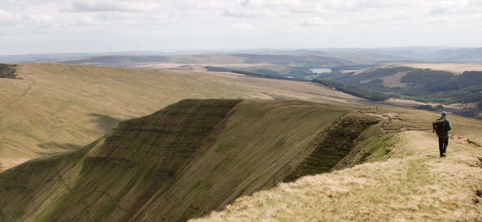 Man walking along Pen Y Fan Ridge