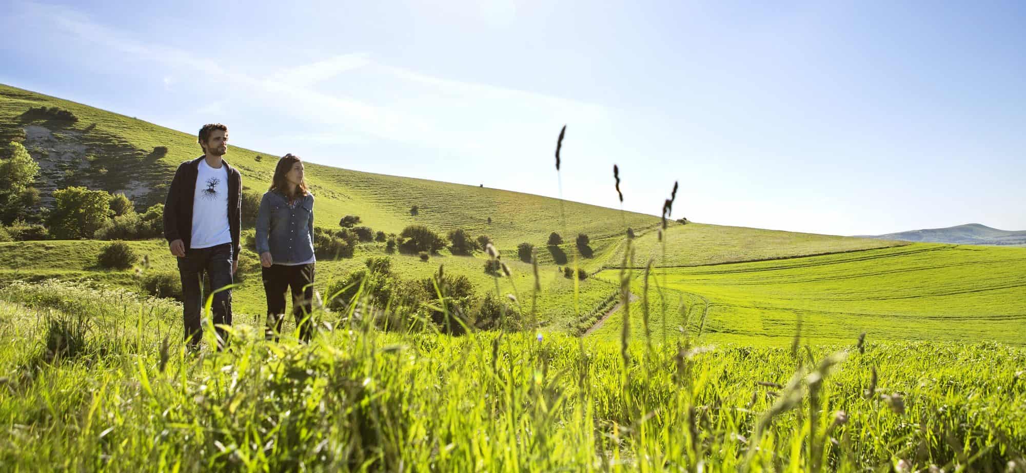 Couple strolling through the English countryside